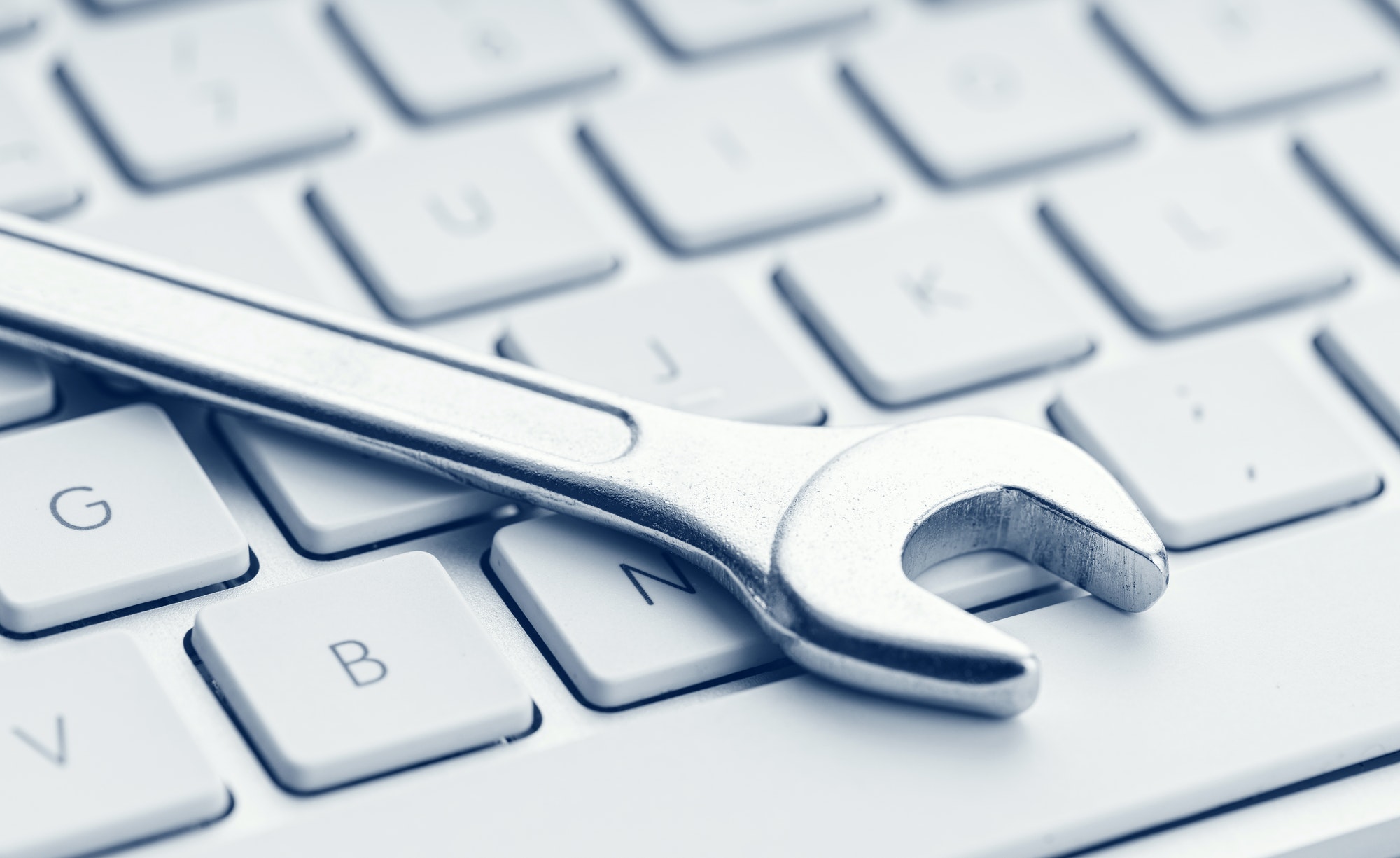 Wrench on computer keyboard